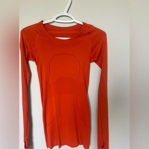 discontinued orange Lululemon long sleeve swiftly tech shirt